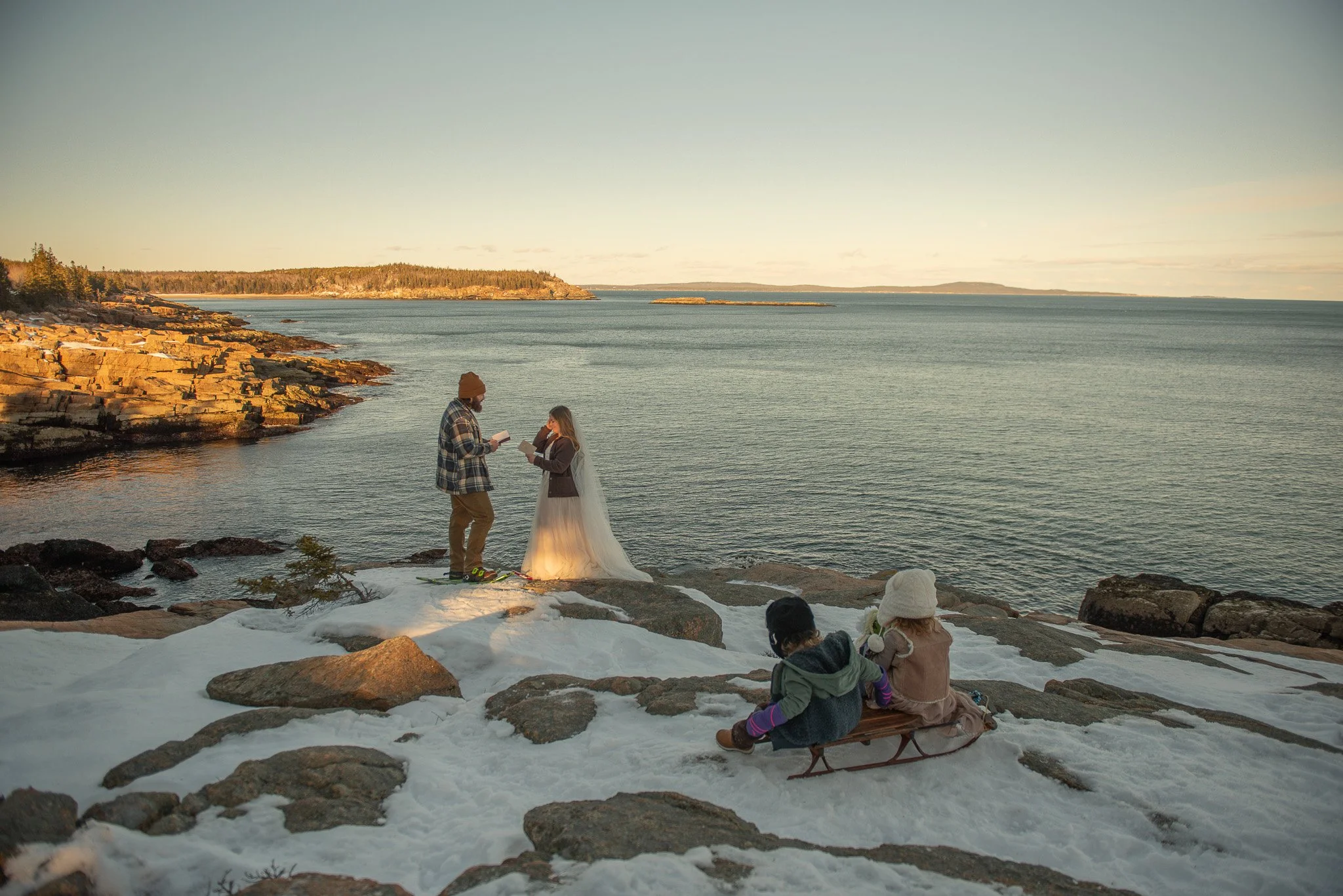 winter acadia elopement on ocean cliffs