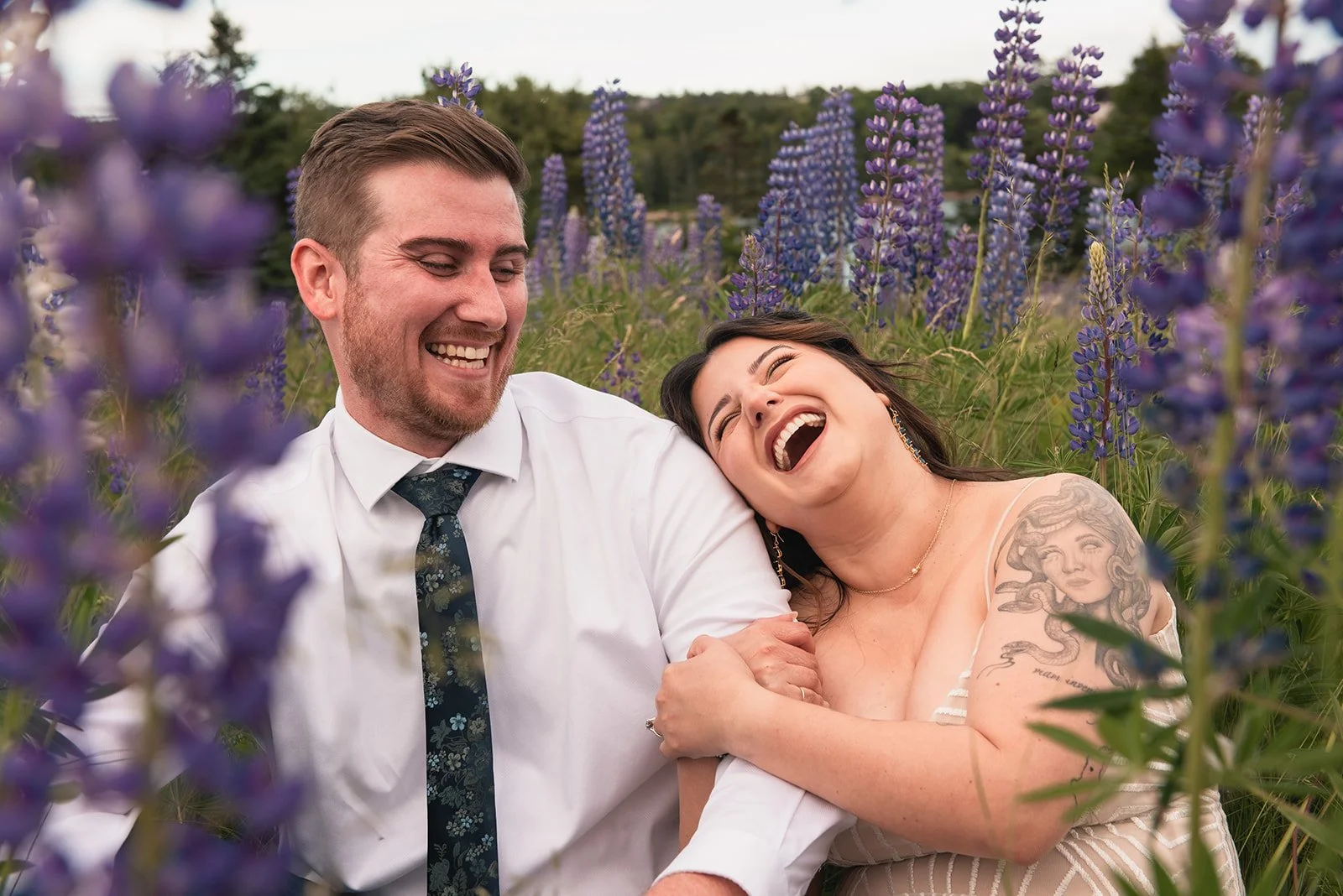 couple laughing in acadia lupine