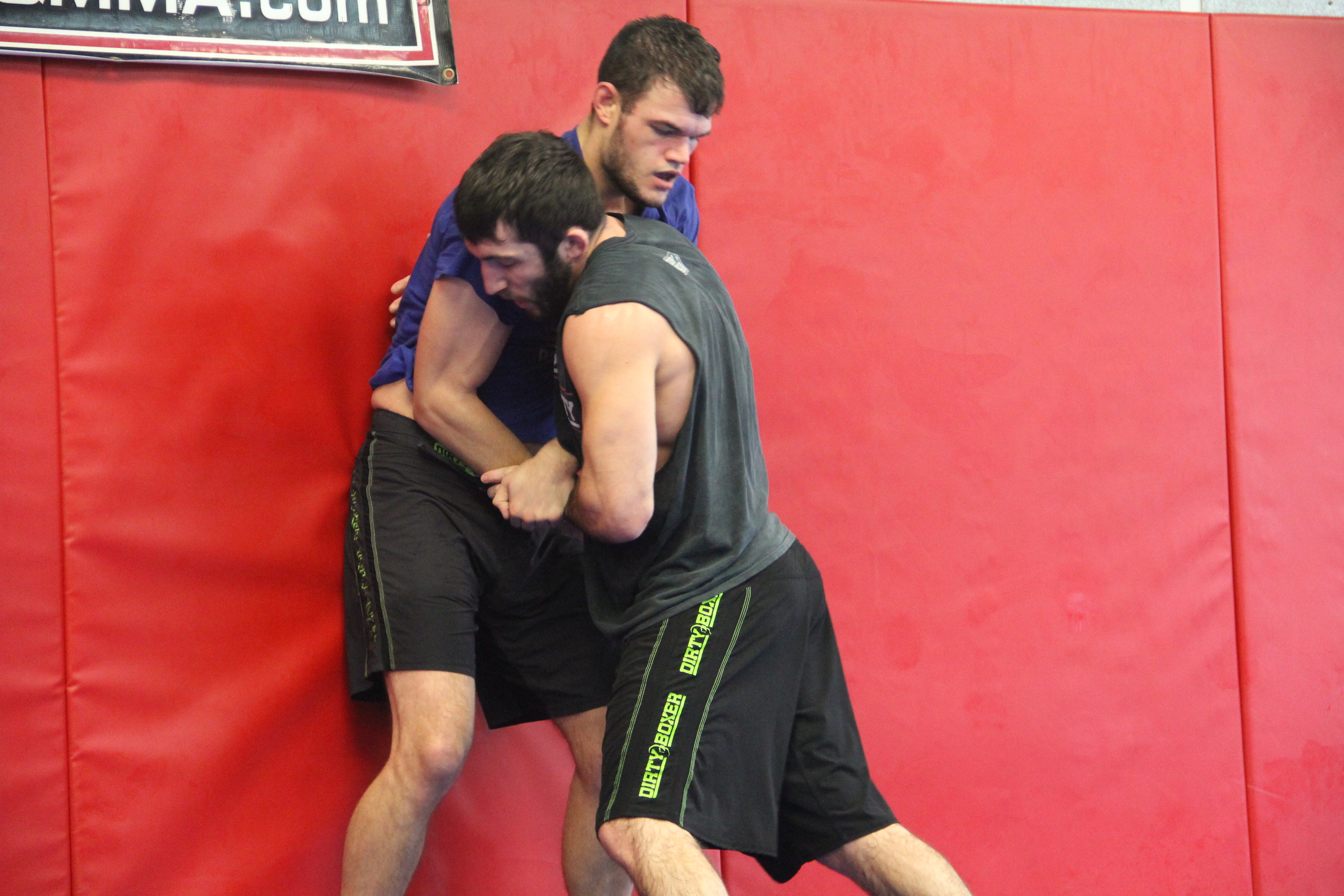 Brazilian jiu jitsu grappling dummy drills striking training gym boxing MMA judo 