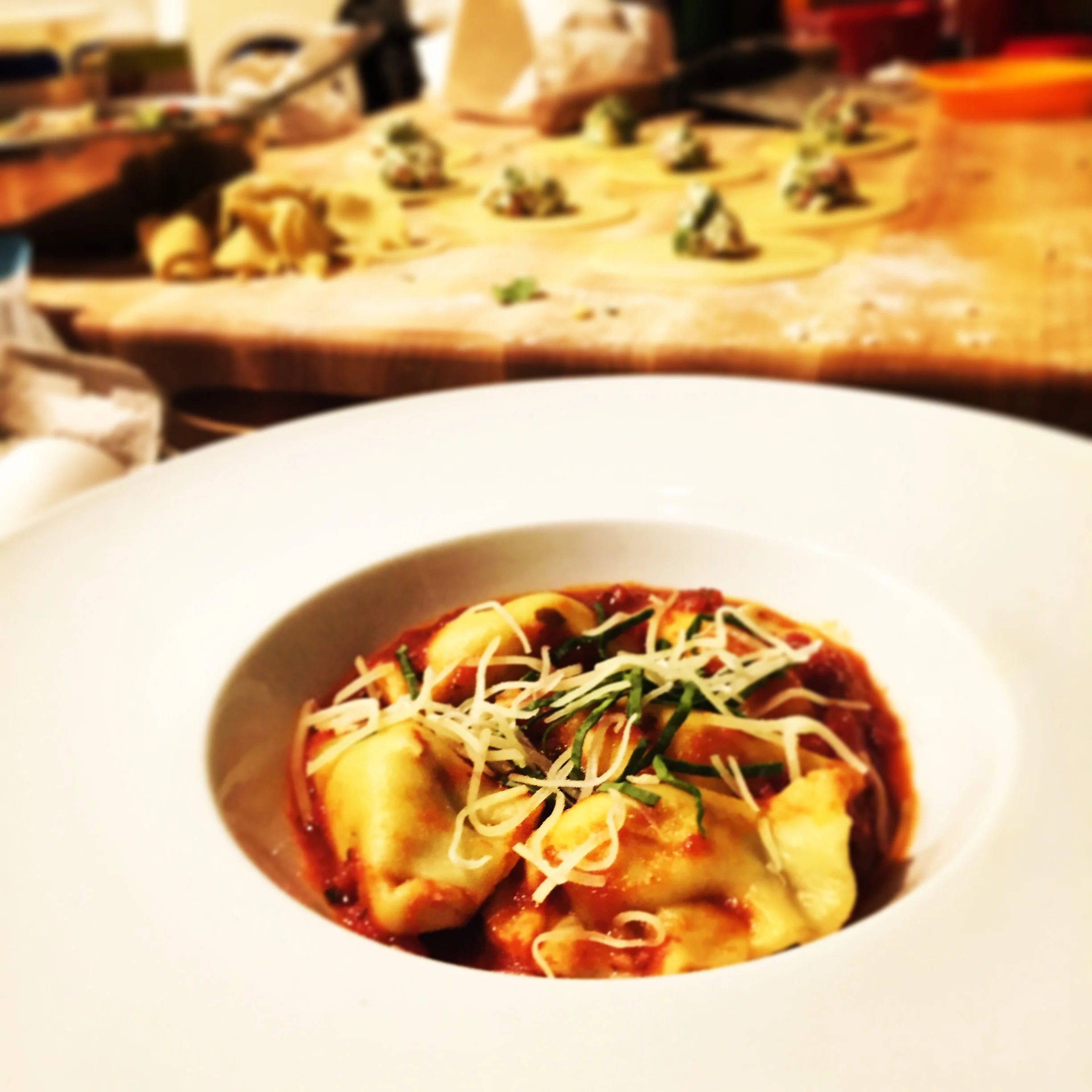 {Gluten free ravioli stuffed with spinach ricotta and prosciutto served in a simple tomato sauce}