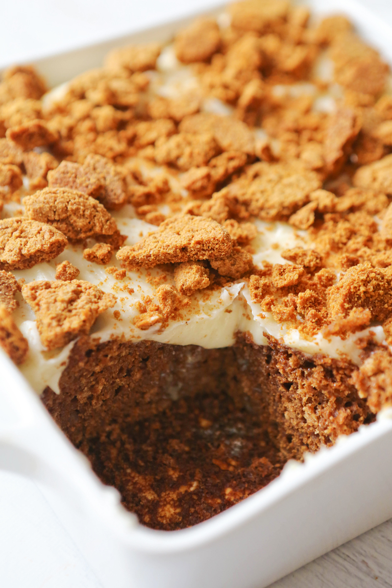 A piece removed from Gingerbread Poke cake pan