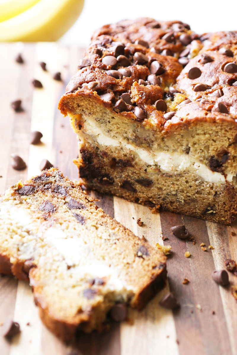 Bread with chocolate chips on top and center exposing cream cheese