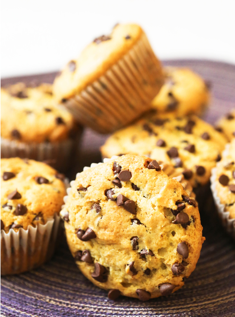 chocolate chip muffins piled on a placemat