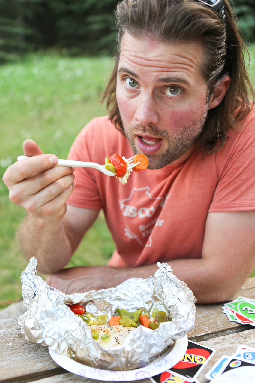 cute hubby eating a meal out of a foil packet