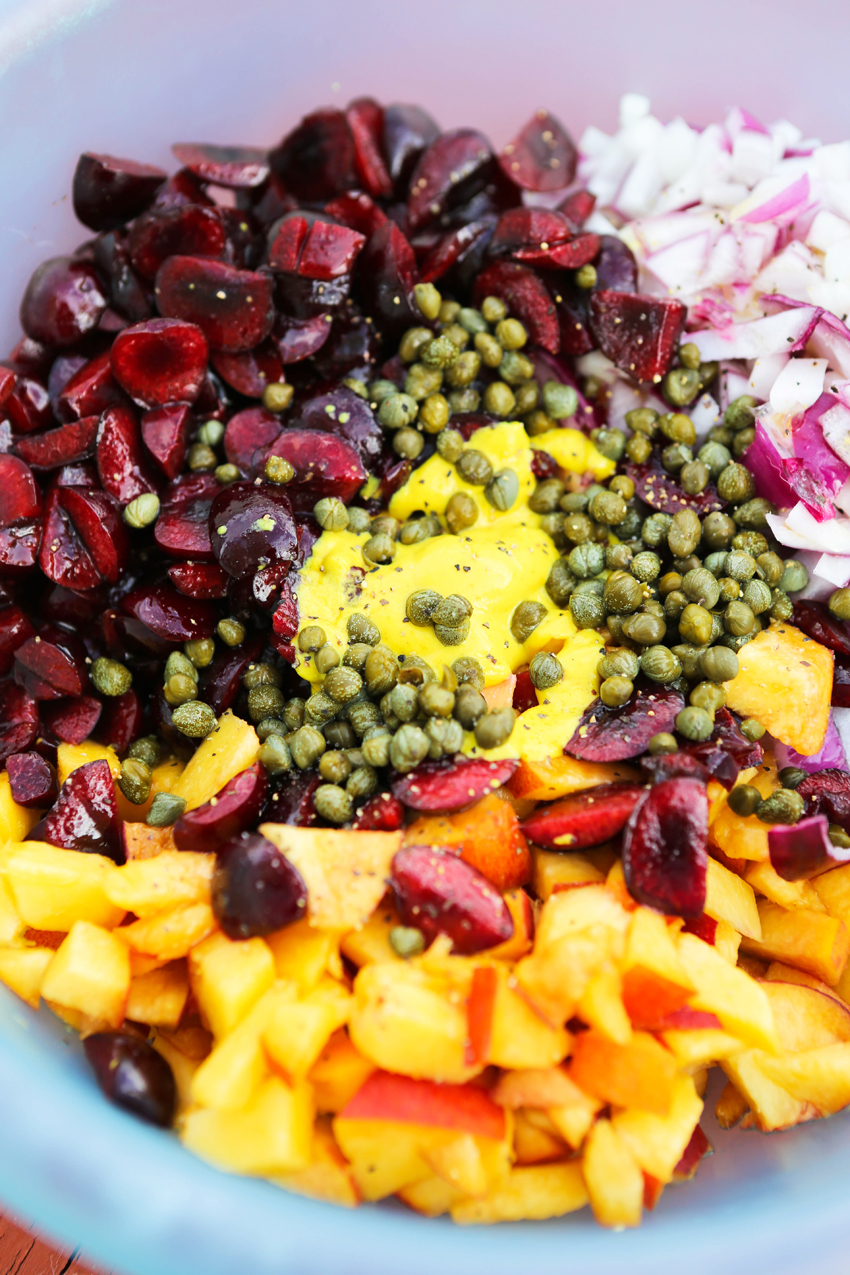 Measured ingredients for peach cherry salsa in a bowl to prepare. 