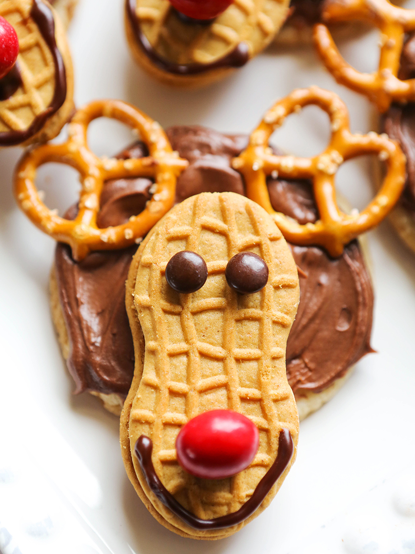 close up of reindeer cookies with pretzel antlers