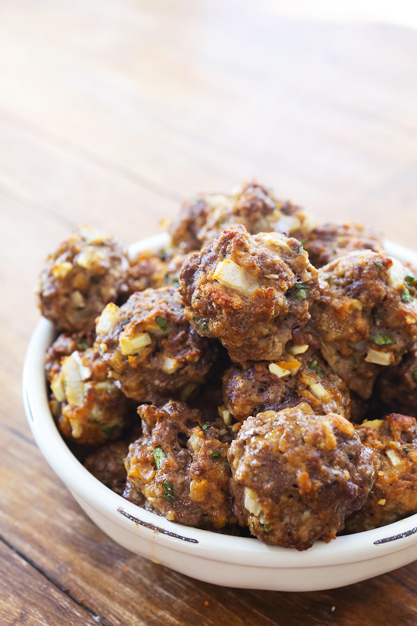 Bowl full of baked meatballs