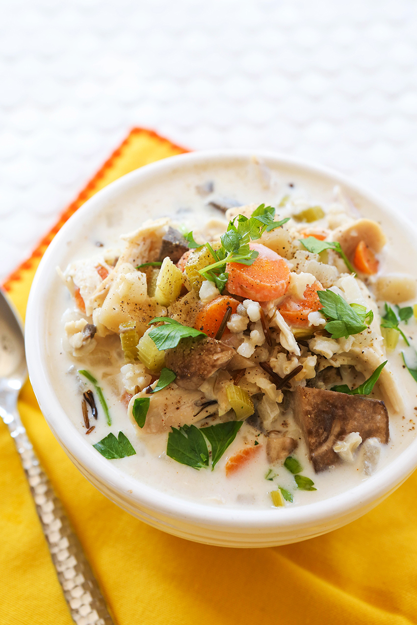 bowl of overflowing crockpot chicken wild rice soup