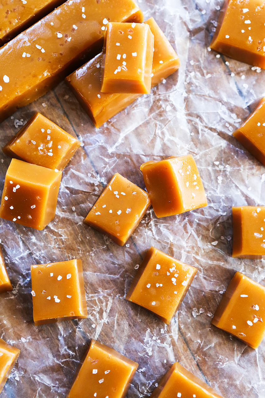 stacked bourbon caramels that have been sprinkled with salt