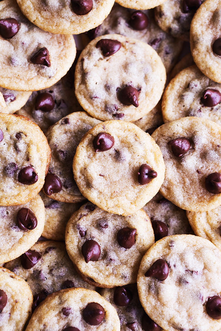 Close up top view of a stack of tons of chocolate chip cookies