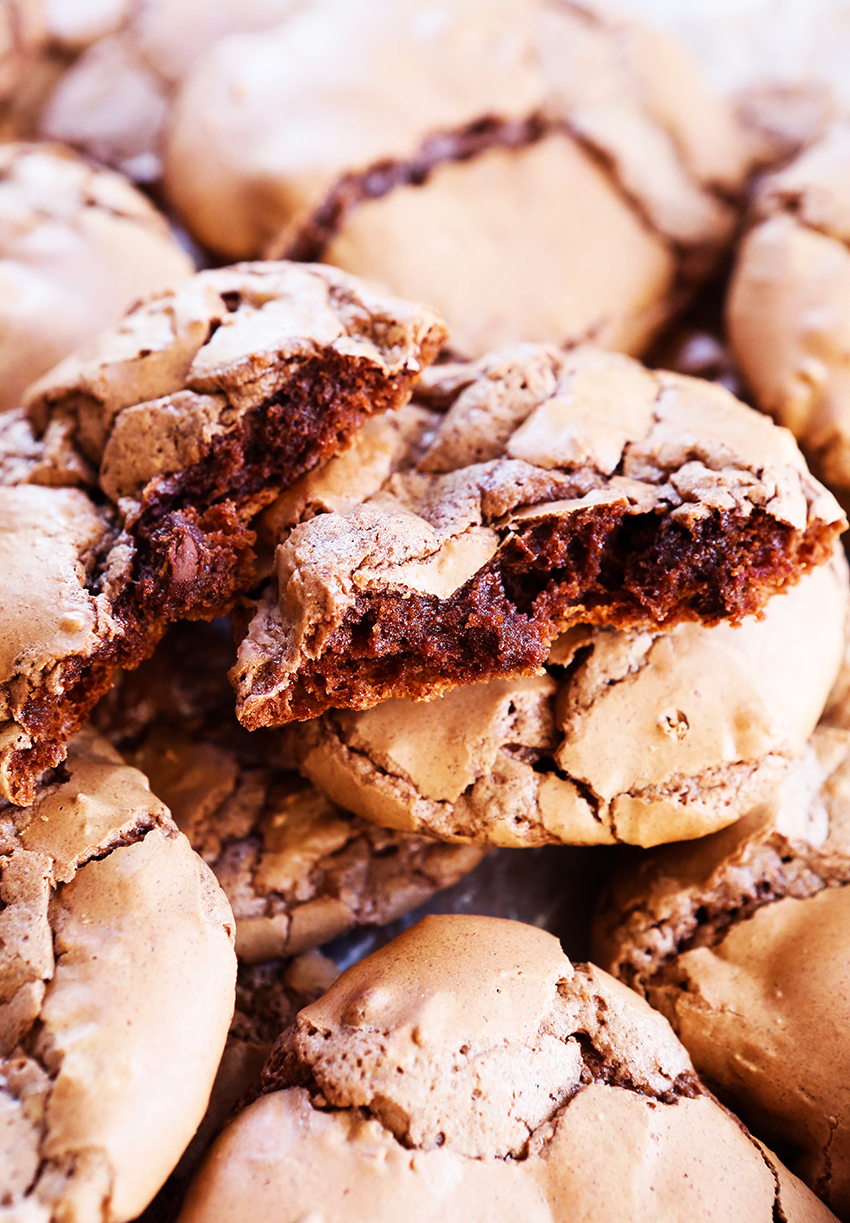 crinkly chocolate cookies stacked on top of one another