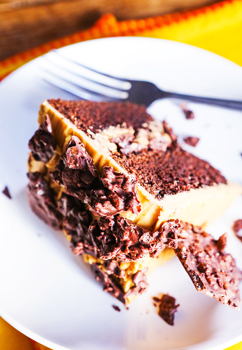 perfect piece of chocolate cake on a white plate with fork next to it