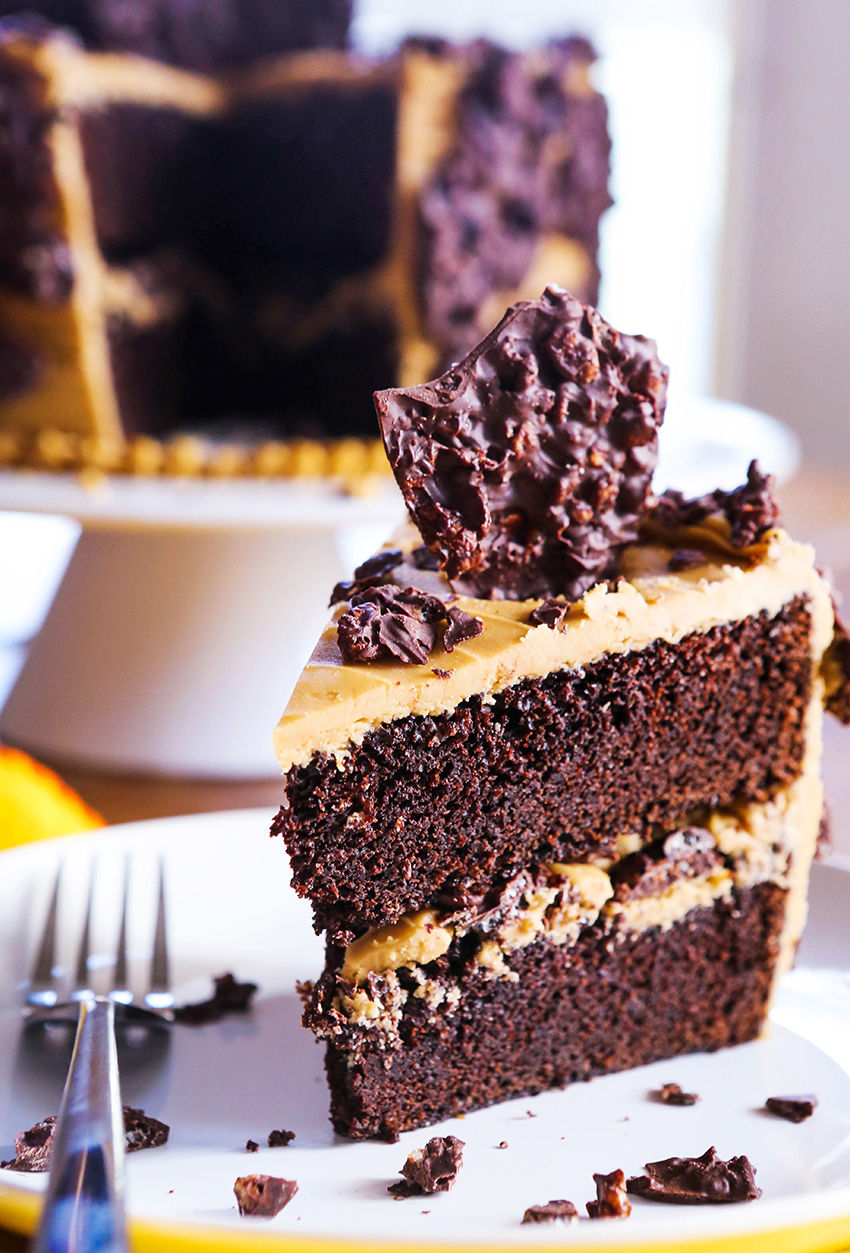 slice of chocolate cake with crunchy piece of chocolate sticking out top