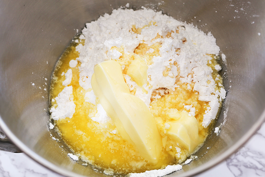 Mixing bowl filled with ingredients to make frosting with