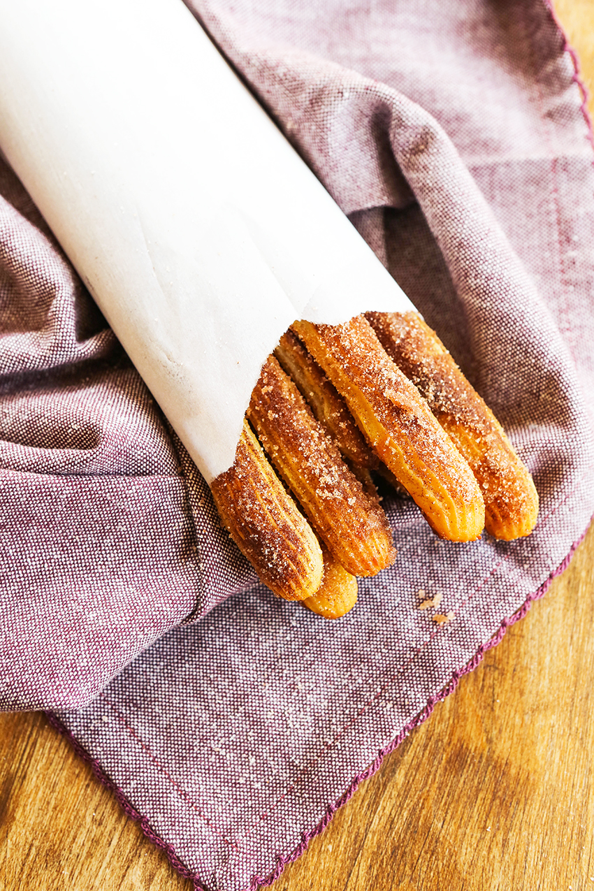 churros wrapped up snugly in parchment paper