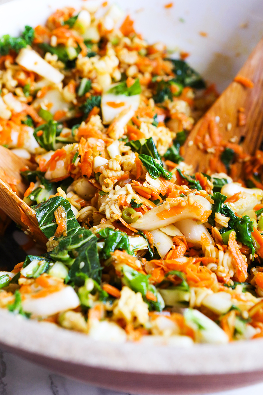 close up of crunch bok choy salad with salad spoon inside