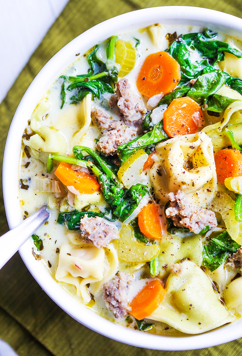 close up of a bowl of creamy tortellini soup