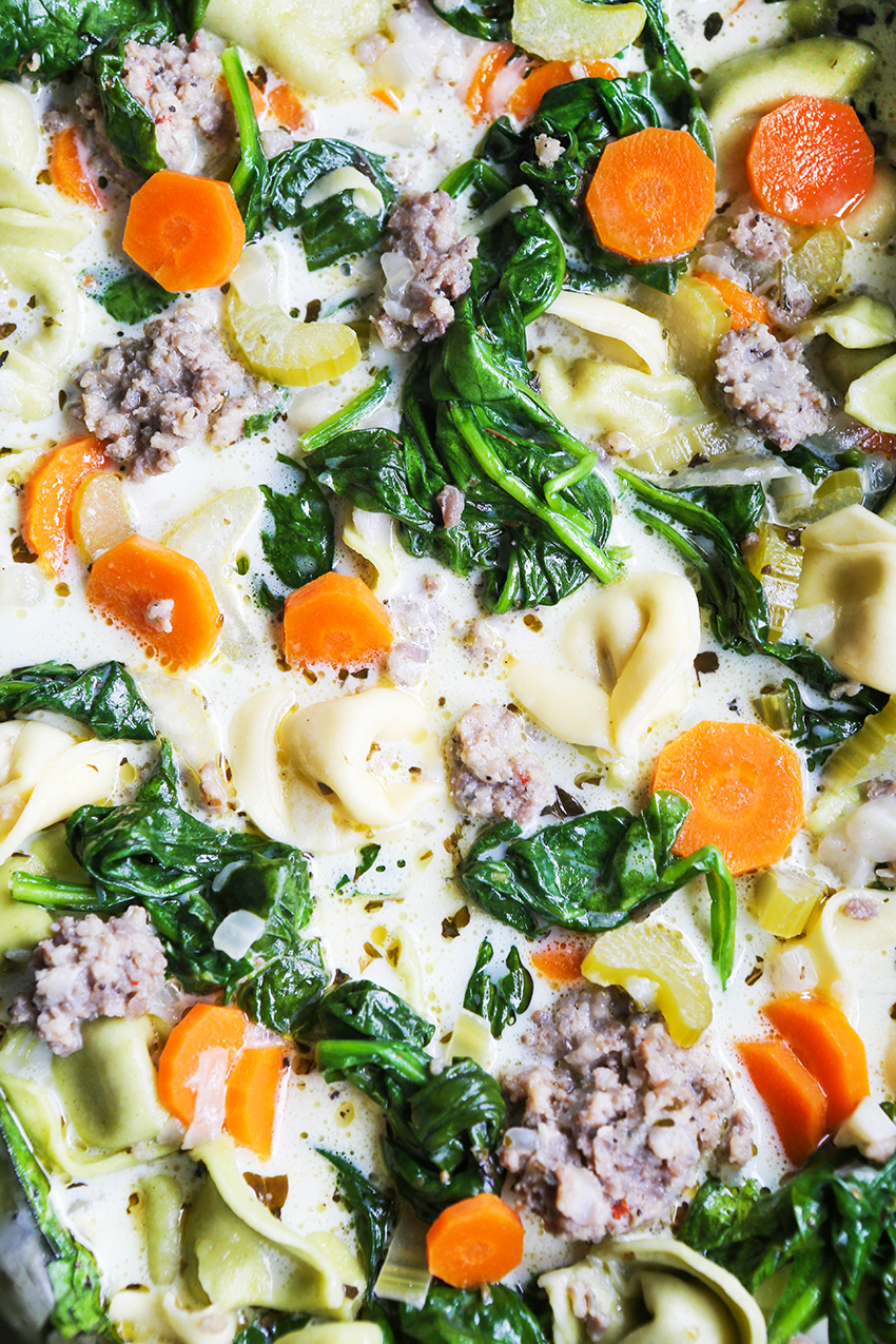 close up of creamy tortellin soup ingredients