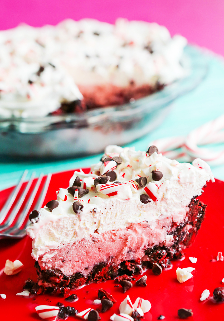 side view of peppermint milkshake pie with crushed candy cane pieces on the plate