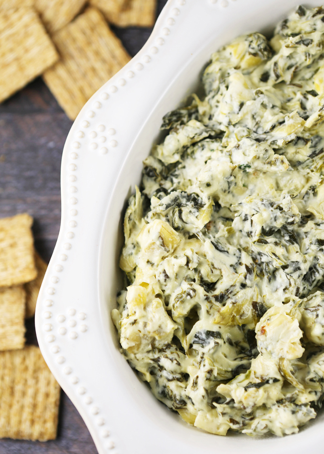 top view of serving bowl of spinach artichoke dip