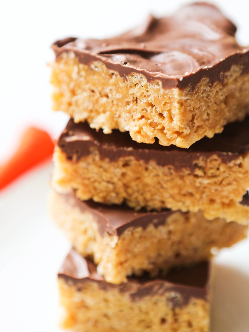 stack of rice krispies treats topped with chocolate