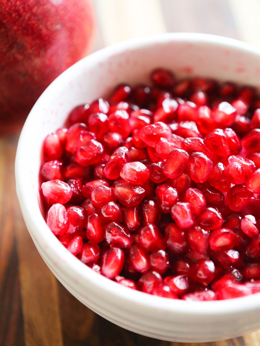 Close up of a bowl full of pomegranate seeds