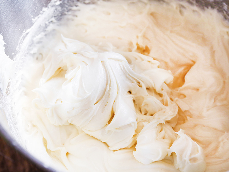  Creamy cream cheese frosting in mixing bowl 