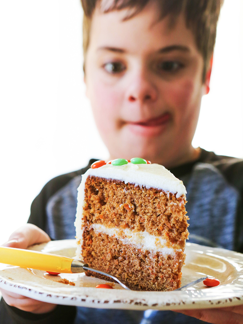  Cute boy staring at a piece of carrot cake 