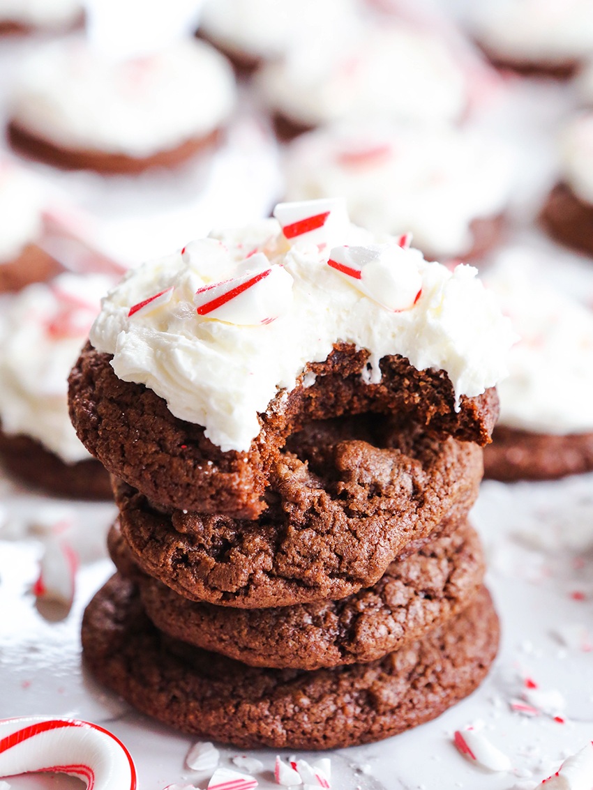 stacked chocolate cookies with the top one smothered in frosting