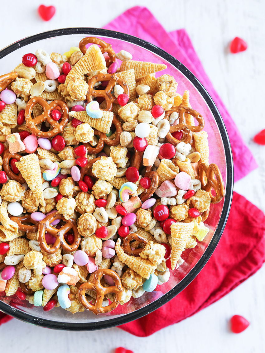 top view of large bowl of valentine snack mix