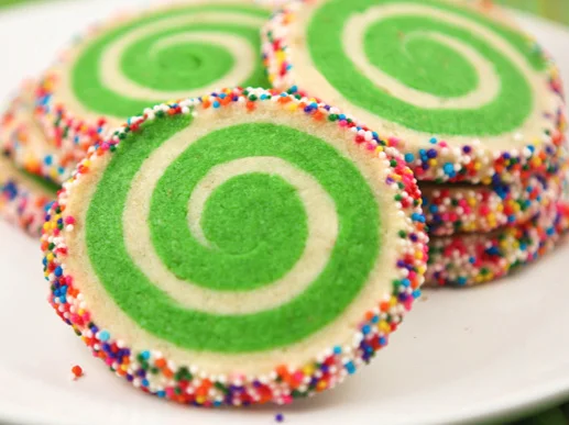 spiral cookies with sprinkles on a serving plate