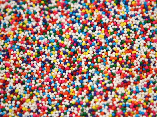 close up of nonpareil colored sprinkles