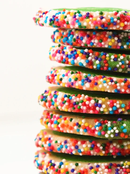 close up side view of baked cookies with sprinkles on outsides