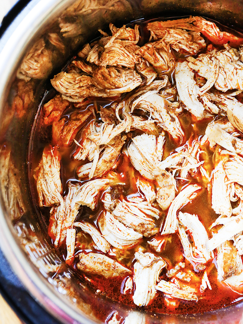 Top view of Instant Pot filled with shredded chicken 