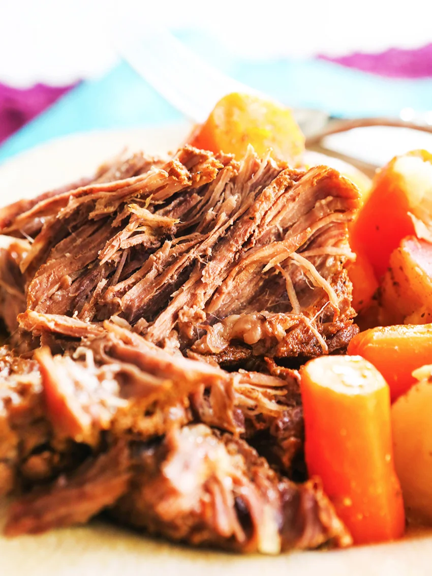 instant pot roast, carrots and potatoes on a plate