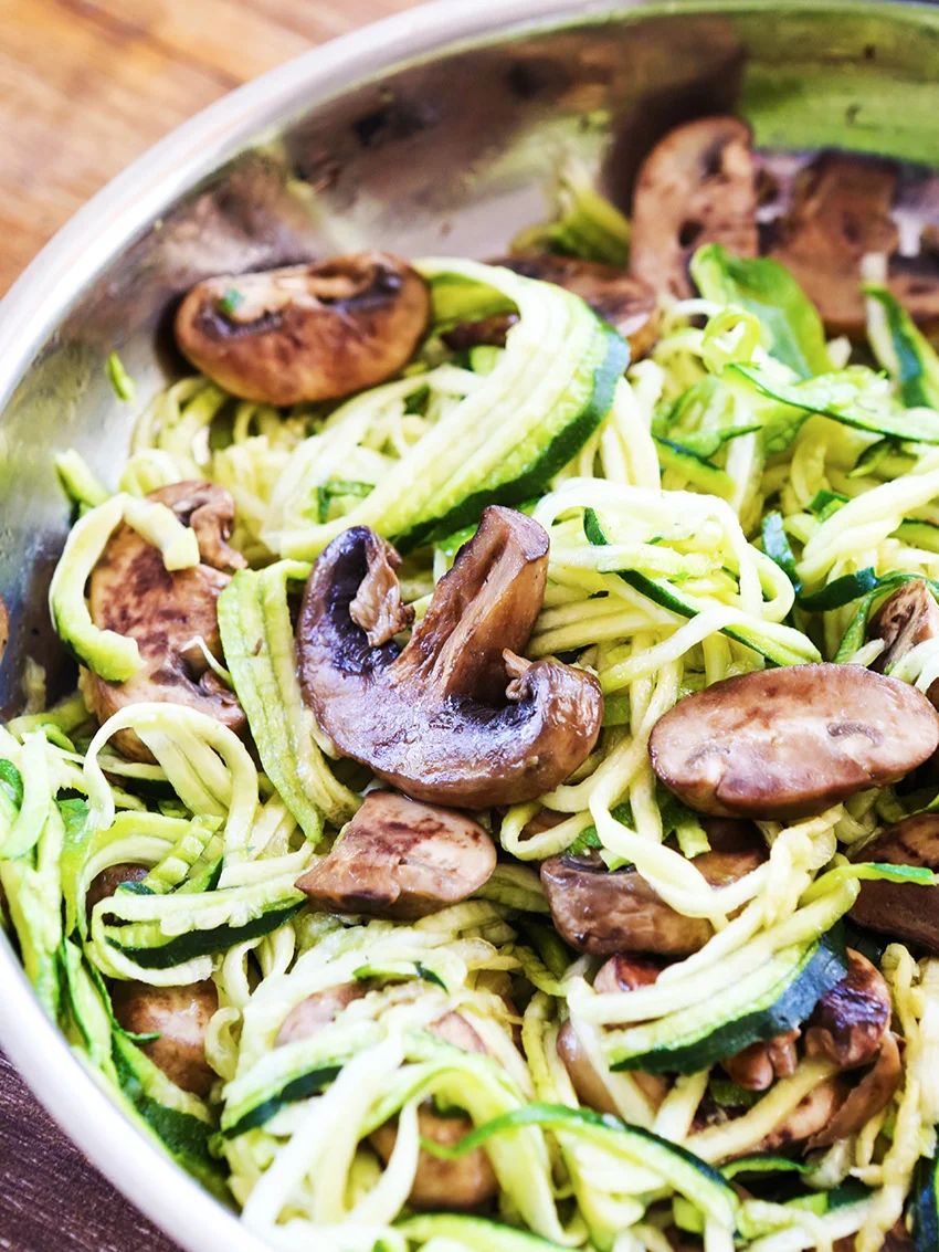 sauteed mushrooms and zoodles in a skillet