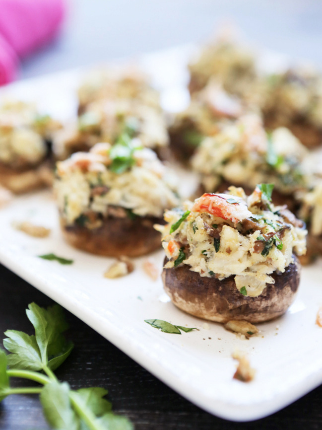 Serving plate loaded with crab stuffed mushrooms 