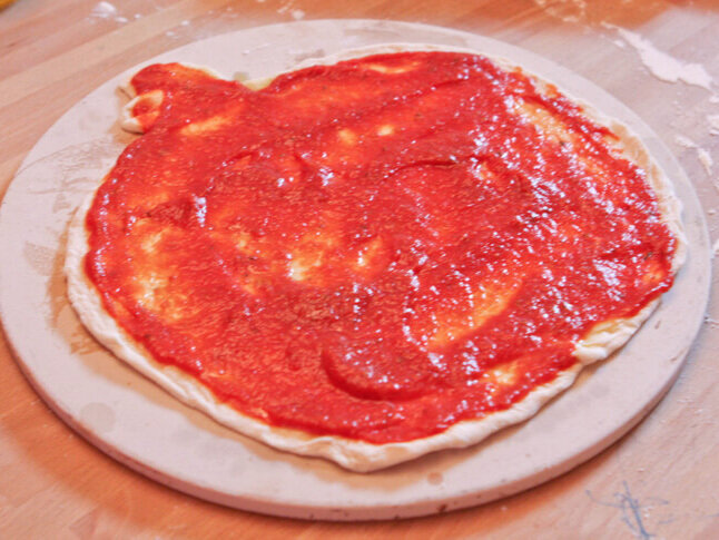  Angry birds shaped pizza with sauce over top 