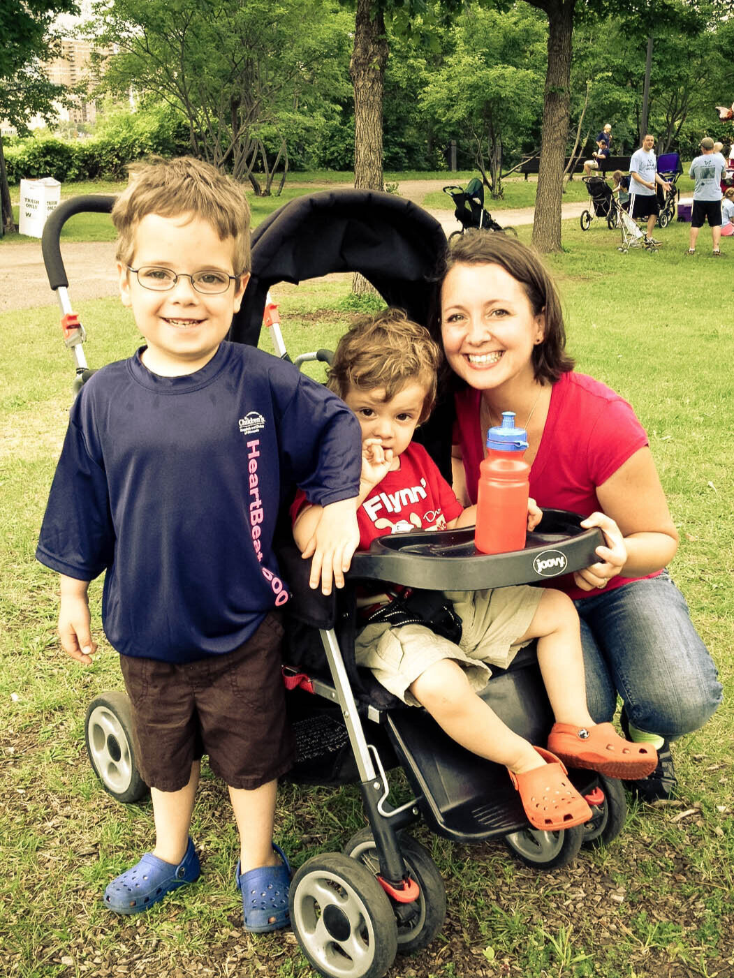  mom and boys next to stroller after heart walk 