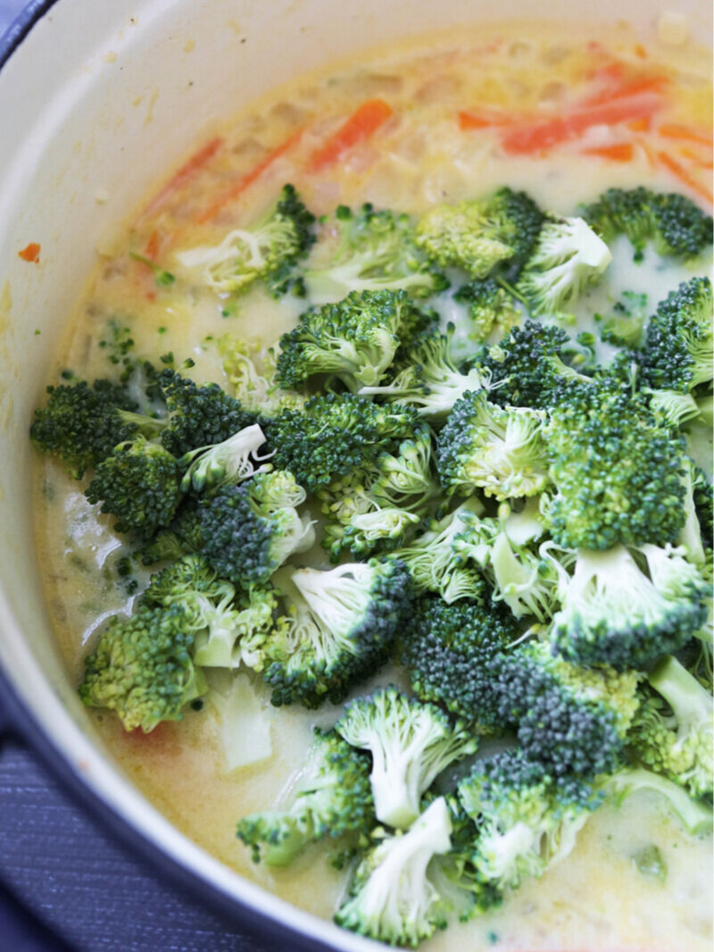  Broccoli poured on top of soup in Dutch oven 