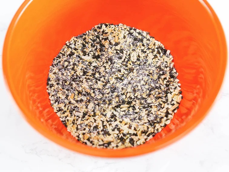  Everything but the Bagel Seasoning mixed together in an orange bowl 