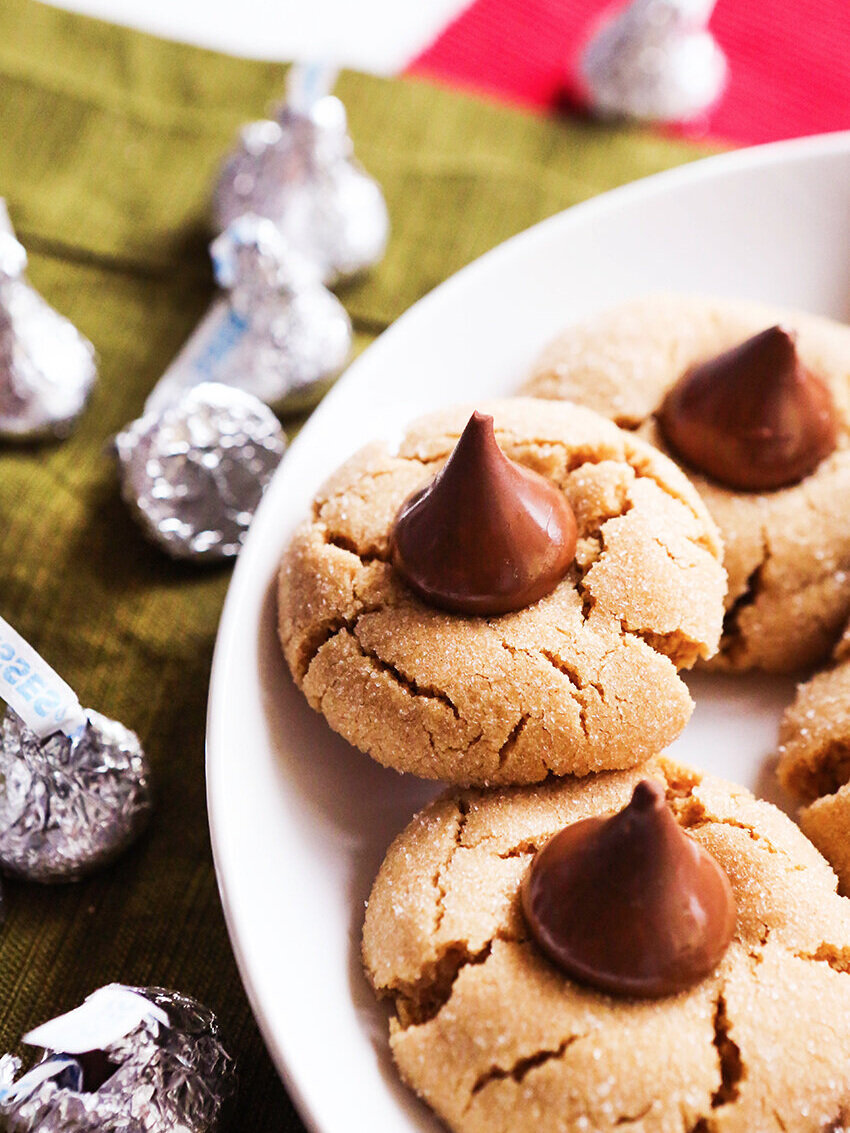 Plate of peanut butter cookies with hershey’s kisses in centers 