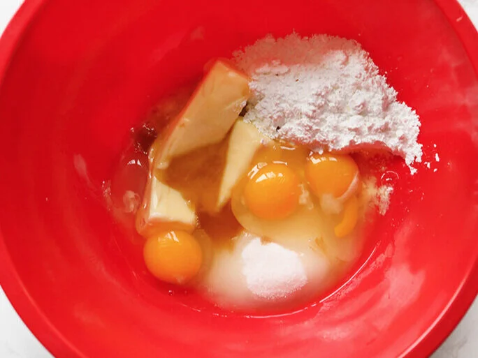 Wet ingredients for christmas cookies in mixing bowl 