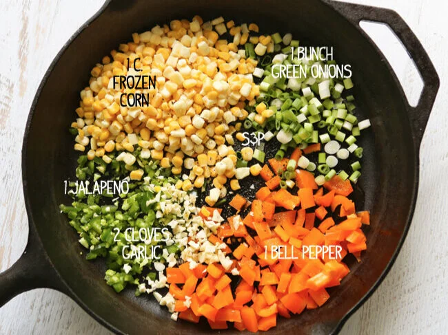 Ingredients in cast iron skillet for hot corn and crab dip 