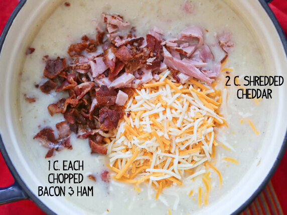 bacon and shredded cheese in Dutch oven on top of soup 