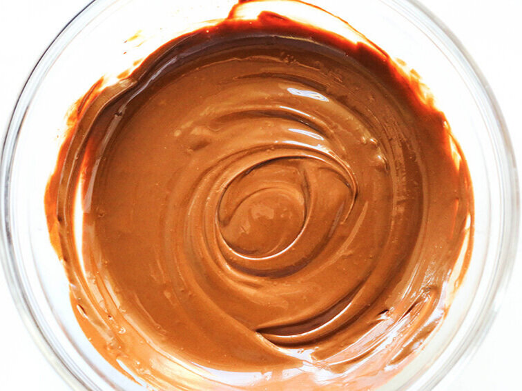 creamy melted chocolate in mixing bowl