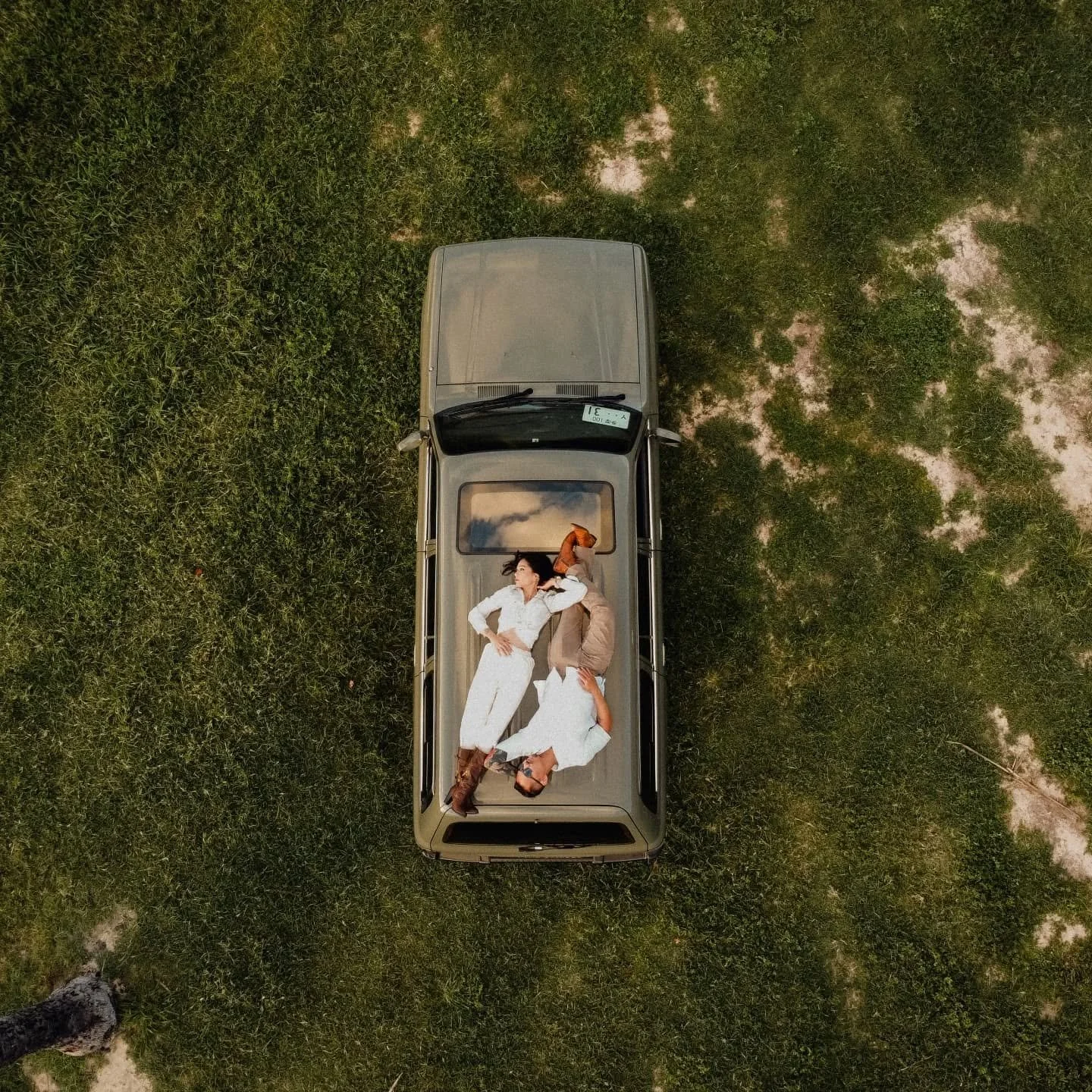 Although sometimes it's a bit time consuming and challenging, one of my favorite ways to break the monotony of a shoot is to make my clients lie down. On anything. From sandy beaches to dry, hot desert sand. On top of trees, or on top of cars. From s