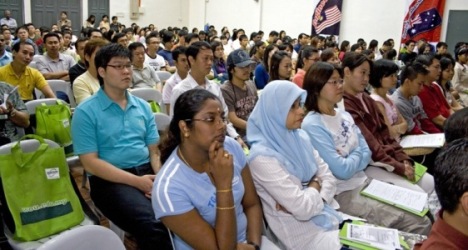 Newly-registered students listen during the orientation.