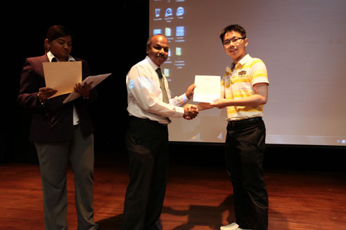 Prakash presents the Dean's List award at the main campus.