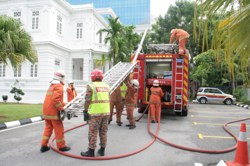 Firefighters in action during the fire drill at the main campus.